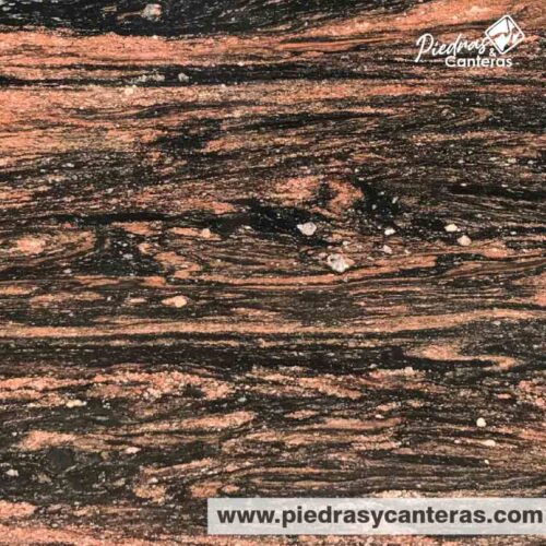 Granito Malibu es granito natural es elegancia en fondo negro con betas rojas, ideal para sobrios contrastes.