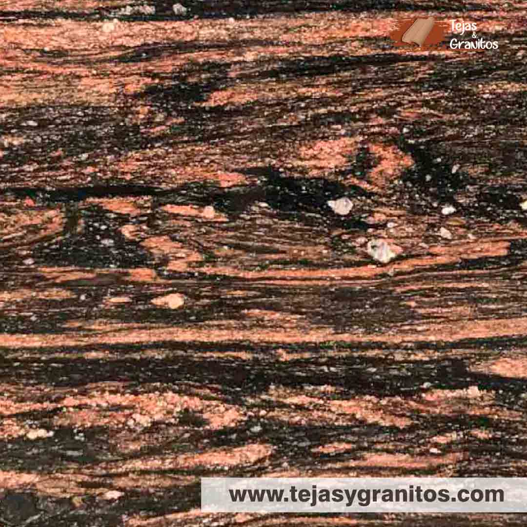 Granito Malibu es granito natural es elegancia en fondo negro con betas rojas, ideal para sobrios contrastes.